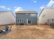 Backyard featuring a patio, grill, and an inviting seating area for outdoor relaxation at 3038 Lydney Cir, Waxhaw, NC 28173