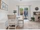 Cozy breakfast nook with bench seating, round table, and sliding door access to the backyard at 3038 Lydney Cir, Waxhaw, NC 28173