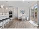 Eat-in kitchen with white cabinets, breakfast bar, breakfast nook, and sliding glass doors at 3038 Lydney Cir, Waxhaw, NC 28173