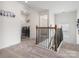 Upstairs hallway featuring a laundry room with modern appliances and easy access to other bedrooms at 3038 Lydney Cir, Waxhaw, NC 28173