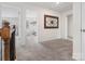 Open hallway with clear sightlines to multiple bedrooms, offering spaciousness and connectivity at 3038 Lydney Cir, Waxhaw, NC 28173