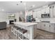 Stunning kitchen with granite countertops, stainless steel appliances, and island seating at 3038 Lydney Cir, Waxhaw, NC 28173