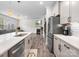 Modern kitchen featuring stainless appliances, granite counters, and island with bar seating at 3038 Lydney Cir, Waxhaw, NC 28173