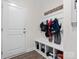 Convenient mudroom featuring a coat rack, bench, and ample shoe storage at 3038 Lydney Cir, Waxhaw, NC 28173