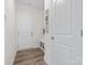 Welcoming mudroom with modern flooring and built-in storage bench at 3038 Lydney Cir, Waxhaw, NC 28173