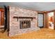Basement featuring a brick fireplace, wood accents and access to the bathroom at 3087 E Nc Hwy 150 Hwy, Lincolnton, NC 28092