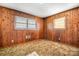 Cozy bedroom with wood paneled walls and neutral carpet at 3087 E Nc Hwy 150 Hwy, Lincolnton, NC 28092