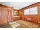 Bedroom features wood paneled walls, vanity with mirror, and neutral carpet at 3087 E Nc Hwy 150 Hwy, Lincolnton, NC 28092