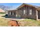 Exterior view showcasing a brick and wood house and outdoor patio at 3087 E Nc Hwy 150 Hwy, Lincolnton, NC 28092