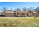 Charming brick and wood home with a well-manicured lawn on a sunny day at 3087 E Nc Hwy 150 Hwy, Lincolnton, NC 28092