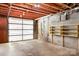 Unfinished garage with cinder block walls, exposed ceiling, and an open garage door at 3087 E Nc Hwy 150 Hwy, Lincolnton, NC 28092