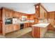 Eat in kitchen featuring wood cabinetry, modern appliances, and bright countertops at 3087 E Nc Hwy 150 Hwy, Lincolnton, NC 28092