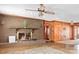 Cozy living room with a brick fireplace and wood paneled walls, exuding warmth and charm at 3087 E Nc Hwy 150 Hwy, Lincolnton, NC 28092
