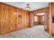Spacious living room featuring wood paneled walls and vintage light fixture at 3087 E Nc Hwy 150 Hwy, Lincolnton, NC 28092