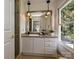 Bathroom featuring a vanity with a beige countertop and a large mirror at 3600 Carmel Rd, Charlotte, NC 28226