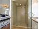 Bathroom featuring a tiled shower, vanity, and entrance to the bedroom at 3600 Carmel Rd, Charlotte, NC 28226