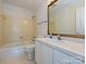 Cozy bathroom features a tub/shower combination and updated vanity at 3600 Carmel Rd, Charlotte, NC 28226