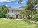 Charming two-story home with black shutters and a well-manicured lawn on a sunny day at 3600 Carmel Rd, Charlotte, NC 28226
