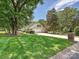 View of home featuring a large manicured lawn, extended driveway, and attached two car garage at 3600 Carmel Rd, Charlotte, NC 28226