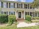 Inviting front entrance with a decorative door, columns, and well-maintained landscaping at 3600 Carmel Rd, Charlotte, NC 28226