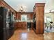 Spacious kitchen features stainless steel appliances, wood cabinets, and a breakfast area at 3600 Carmel Rd, Charlotte, NC 28226
