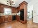 Kitchen features wood cabinetry and modern black appliances at 3600 Carmel Rd, Charlotte, NC 28226