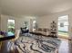 Sunlit living room showcases stylish decor, hardwood floors, and a comfortable seating area at 3600 Carmel Rd, Charlotte, NC 28226