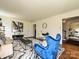 Cozy living room with stylish seating, hardwood floors, and access to dining area and stairs at 3600 Carmel Rd, Charlotte, NC 28226