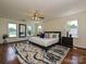 Spacious main bedroom with hardwood floors, a ceiling fan, and plenty of natural light at 3600 Carmel Rd, Charlotte, NC 28226