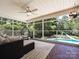 Relaxing screened porch with a view of the pool and landscaped yard at 3600 Carmel Rd, Charlotte, NC 28226