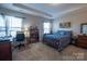 This bedroom includes a bed, desk and a bookcase for additional storage at 3624 County Down Ave # 5-14, Kannapolis, NC 28081