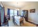 Traditional dining room with a wooden table, china cabinet, and natural light from windows at 3624 County Down Ave # 5-14, Kannapolis, NC 28081