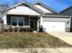 Charming single-story home featuring stone accents, neutral paint, a two-car garage, and a well-manicured lawn at 3624 County Down Ave # 5-14, Kannapolis, NC 28081