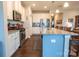 Bright, open kitchen with white cabinets, granite countertops, and a large center island at 3624 County Down Ave # 5-14, Kannapolis, NC 28081