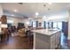 Open-concept design featuring an island with barstool seating connecting living spaces at 3624 County Down Ave # 5-14, Kannapolis, NC 28081