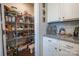 Walk-in pantry with wire shelving for ample storage, located off kitchen area at 3624 County Down Ave # 5-14, Kannapolis, NC 28081