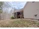 Back of the house featuring a screened in porch, back deck, and stairs to the yard at 369 Falcon Dr, Concord, NC 28025