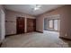 Cozy bedroom featuring carpet, wood trim and natural light at 369 Falcon Dr, Concord, NC 28025