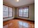 Bedroom with wood floors, natural light, and wooden trim at 369 Falcon Dr, Concord, NC 28025