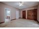 Spacious bedroom featuring a ceiling fan and natural wood trim accents at 369 Falcon Dr, Concord, NC 28025
