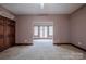 Cozy bedroom featuring carpet, wood trim and natural light at 369 Falcon Dr, Concord, NC 28025