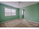 Bedroom with carpet flooring, natural light from window, and ceiling fan at 369 Falcon Dr, Concord, NC 28025