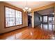 Dining room featuring hardwood floors, modern lighting, and an open layout at 369 Falcon Dr, Concord, NC 28025