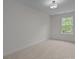 Bedroom with neutral carpet and large window at 4109 Walking Ridge Rd # 57, Charlotte, NC 28208