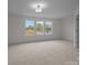 Spacious bedroom with three large windows allowing natural light at 4109 Walking Ridge Rd # 57, Charlotte, NC 28208