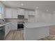 Bright kitchen with white cabinets, stainless steel appliances and large island at 4109 Walking Ridge Rd # 57, Charlotte, NC 28208