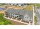 Aerial view of newly built townhomes with green grass and sidewalk near the roadway at 4113 Walking Ridge Rd # 56, Charlotte, NC 28208