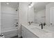 Bright bathroom featuring double sinks, modern fixtures, large mirror, and a shower and bathtub combination at 4113 Walking Ridge Rd # 56, Charlotte, NC 28208