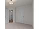 This carpeted bedroom features a neutral palette and adjoining bathroom at 4113 Walking Ridge Rd # 56, Charlotte, NC 28208