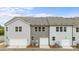 Rear exterior of new construction townhouses with garages and lush green space at 4113 Walking Ridge Rd # 56, Charlotte, NC 28208